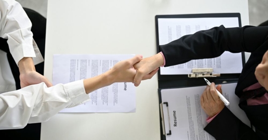 Shaking hands at interview for job